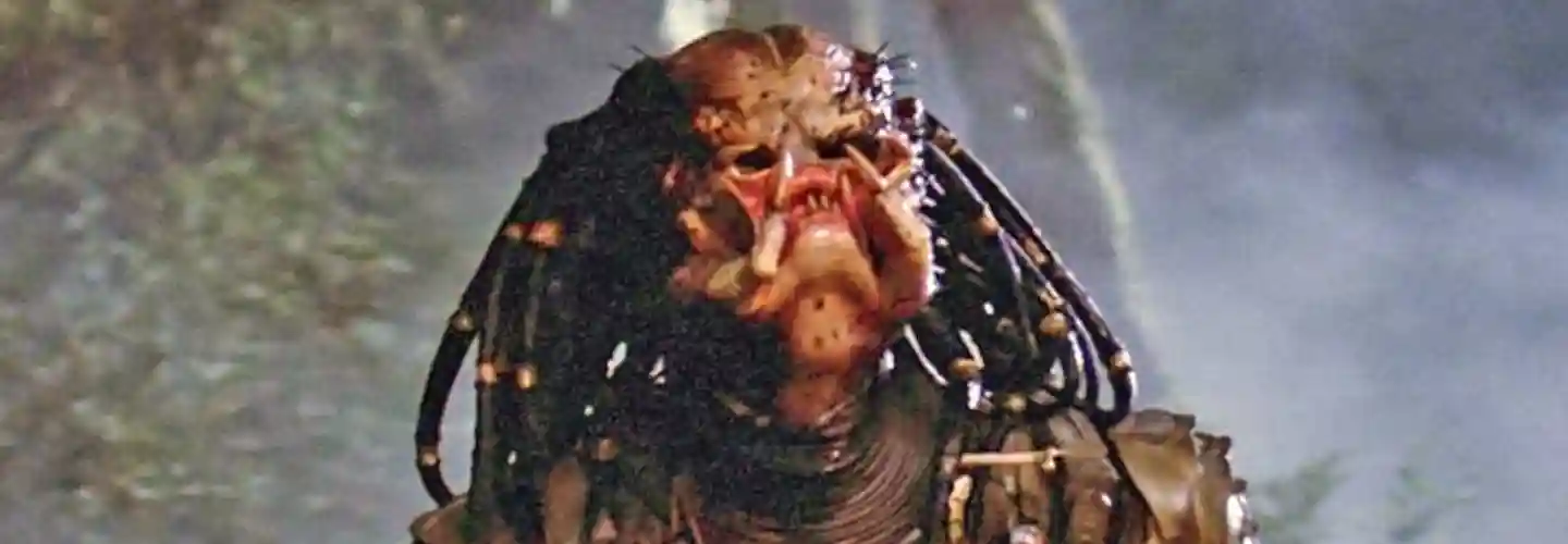 The titular Predator from Predator (1987), starring Arnold Schwarzenegger and Carl Weathers