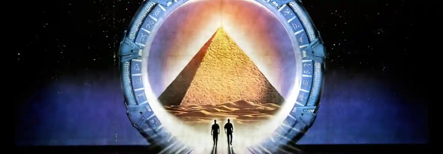 Two silhouettes walk through a Stargate into Abydos, on the poster for Stargate (1994)