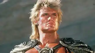 Dolph Lundgren (with muscles) as He-Man in the Masters of the Universe game.